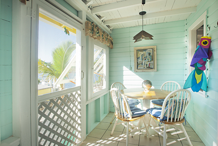Screen porch is wonderfully cool and breezy, ideal for dining and/or family board games.