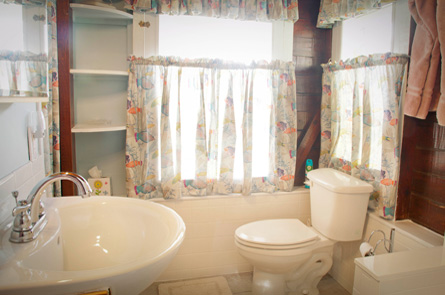 Complete renovation of the bathroom including an all-new, wonderful ceramic-tiled shower, lovely basin sink build-in, fresh curtains, linens and shelving.