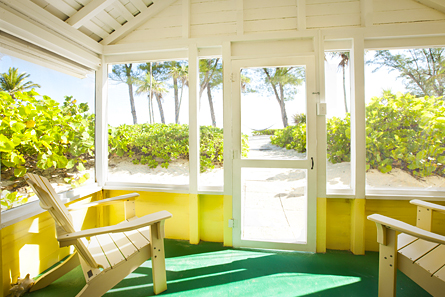 Palmetto screen porch with chairs.