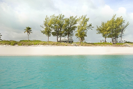 An ocean view of Seagrape Cottage and Long Bay Beach.